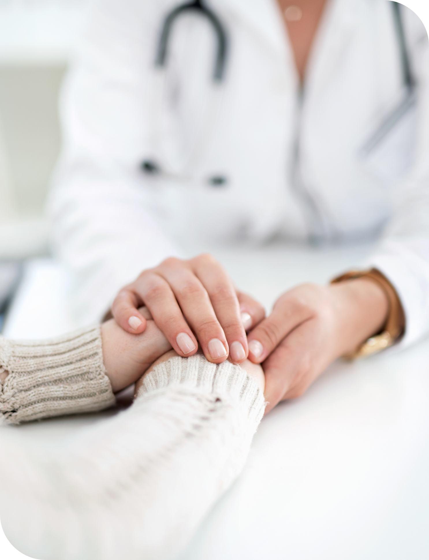 Doctor holding a patient's hands